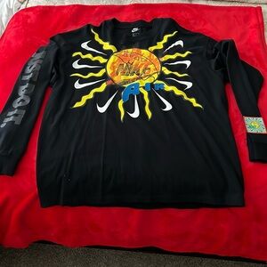 Black and Yellow Long Sleeve Nike Shirt with graphic designs